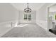 Light-filled dining room with large windows and classic trim at 990 Lilac Arbor Rd, Dacula, GA 30019