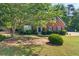 Beautiful brick home with manicured lawn and mature trees in a desirable neighborhood at 990 Lilac Arbor Rd, Dacula, GA 30019