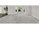 Bright living room features a bay window and neutral carpet at 990 Lilac Arbor Rd, Dacula, GA 30019