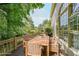 Inviting back deck featuring a wooden table and chairs, perfect for outdoor dining at 1354 Benbrooke Nw Ln, Acworth, GA 30101