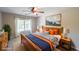 Comfortable bedroom featuring a wooden bed frame, bright colors, and natural light at 1354 Benbrooke Nw Ln, Acworth, GA 30101