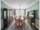 Elegant dining room features hardwood floors, wainscoting, and traditional furnishings at 1354 Benbrooke Nw Ln, Acworth, GA 30101