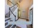 Open foyer showcasing a staircase with white railings, a new roof, and stylish interior design at 1354 Benbrooke Nw Ln, Acworth, GA 30101
