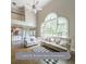 Bright, open floor plan living room with large windows, a cathedral ceiling, and hardwood floors at 1354 Benbrooke Nw Ln, Acworth, GA 30101