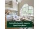 Bright, open-concept living space with tall windows and adjoined to a modern kitchen at 1354 Benbrooke Nw Ln, Acworth, GA 30101