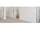 Bedroom featuring neutral carpet, white walls, and walk-in closets at 229 Kenoot Dr # 49, Mcdonough, GA 30253