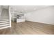Open floor plan featuring stairs, hardwood floors, kitchen with island, and bright living area at 229 Kenoot Dr # 49, Mcdonough, GA 30253