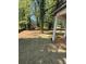 Spacious backyard featuring mature trees, newly installed sod, and partial view of home at 3089 Corbin Ave, Decatur, GA 30034