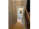 Bright bathroom with a white vanity and modern lighting as seen from the stairs at 3089 Corbin Ave, Decatur, GA 30034