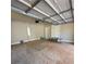Spacious two car garage with overhead lighting perfect for car storage and additional workspace at 3089 Corbin Ave, Decatur, GA 30034
