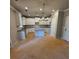 The large kitchen features granite countertops, white cabinets and stainless steel appliances at 3089 Corbin Ave, Decatur, GA 30034