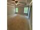 Expansive bedroom offers a tray ceiling, a ceiling fan and multiple windows that provide ample natural light at 3089 Corbin Ave, Decatur, GA 30034