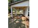 Covered patio featuring wood ceiling, fan, and freshly poured concrete with landscaping at 3089 Corbin Ave, Decatur, GA 30034