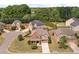 An aerial view shows a well-situated home in a neighborhood with mature trees and manicured lawns at 4360 Carver Ct, Cumming, GA 30040