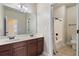 Bright bathroom featuring double sinks, sleek vanity, and a shower-tub combination at 4360 Carver Ct, Cumming, GA 30040