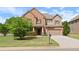 Charming brick two-story home with a well-manicured lawn, two-car garage, and inviting entryway at 4360 Carver Ct, Cumming, GA 30040
