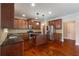 Well-equipped kitchen with stainless steel appliances, granite countertops, and dark wood cabinets at 4360 Carver Ct, Cumming, GA 30040