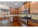 Stylish kitchen with stainless steel appliances, granite counters, and custom wood cabinetry at 4360 Carver Ct, Cumming, GA 30040