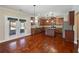 Modern kitchen with dark wood cabinets, stainless steel appliances, and a center island for food prep at 4360 Carver Ct, Cumming, GA 30040