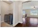 Convenient laundry area with modern washer and dryer, next to an upstairs bonus room with hardwood floors at 4360 Carver Ct, Cumming, GA 30040