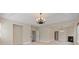 Spacious living room with a fireplace, tray ceiling, and elegant chandelier at 4360 Carver Ct, Cumming, GA 30040