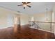 Open upstairs loft with hardwood floors, decorative wrought iron, and natural light at 4360 Carver Ct, Cumming, GA 30040