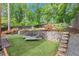 Well-maintained yard featuring tiered beds and lounging area at 479 Clifton Se St, Atlanta, GA 30316