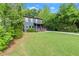 Charming two-story home with a well-manicured lawn, mature trees, and driveway at 479 Clifton Se St, Atlanta, GA 30316