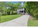 Charming two-story home with a long concrete driveway and a well-manicured lawn at 479 Clifton Se St, Atlanta, GA 30316
