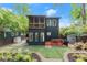 Back of house with a screened-in porch and tiered yard with landscaping at 479 Clifton Se St, Atlanta, GA 30316