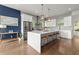Modern kitchen featuring a large center island, stainless steel appliances, and pendant lighting at 479 Clifton Se St, Atlanta, GA 30316