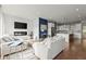 Modern living room with stylish sofas, a fireplace, and an open-concept kitchen at 479 Clifton Se St, Atlanta, GA 30316