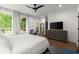Airy main bedroom showcasing a calming decor, hardwood floors, and an outside patio view at 479 Clifton Se St, Atlanta, GA 30316