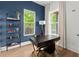 Well-lit office with dark desk, shelving, and large windows at 479 Clifton Se St, Atlanta, GA 30316