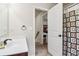 Bathroom with a shower with patterned curtain, single sink vanity, and a mirror at 4970 Roseman Trl, Cumming, GA 30040