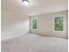 Bedroom with neutral carpet, white walls, and two windows bringing in natural light at 4970 Roseman Trl, Cumming, GA 30040