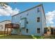 Two-story home with a deck and a spacious backyard, perfect for outdoor gatherings and relaxation at 4970 Roseman Trl, Cumming, GA 30040