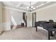 Open-concept living room with coffered ceilings, and a staircase at 4970 Roseman Trl, Cumming, GA 30040