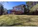 A nice backyard featuring a multi-level deck, sunroom and beautiful lawn at 6841 Fairway Ridge Dr, Douglasville, GA 30134