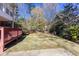 Backyard featuring an expansive wooden deck and verdant lawn at 6841 Fairway Ridge Dr, Douglasville, GA 30134