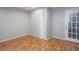 Finished basement area with wood-look flooring and a door at 6841 Fairway Ridge Dr, Douglasville, GA 30134