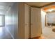 Unfinished basement featuring wood-look floors, walk-out door, and storage closet at 6841 Fairway Ridge Dr, Douglasville, GA 30134