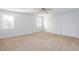 Bright bedroom with neutral carpet, two windows and a closet providing ample natural light at 6841 Fairway Ridge Dr, Douglasville, GA 30134