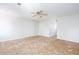 Neutral carpeted bedroom with ceiling fan and closet, offering comfortable space at 6841 Fairway Ridge Dr, Douglasville, GA 30134