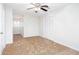 Bedroom featuring neutral carpet, ceiling fan and access to other rooms in the home at 6841 Fairway Ridge Dr, Douglasville, GA 30134