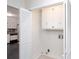 Convenient laundry area with bi-fold doors, white cabinets, and washer/dryer hookups at 6841 Fairway Ridge Dr, Douglasville, GA 30134