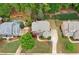 Overhead view of a beautiful home featuring a lush green lawn and meticulous landscaping at 893 Paces Farm Sw Trl, Marietta, GA 30064