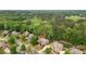 Overhead view of houses surrounded by green space featuring expansive lawns and mature landscaping at 893 Paces Farm Sw Trl, Marietta, GA 30064