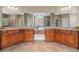 Bathroom vanity features double sinks and a large mirror with decorative lighting at 893 Paces Farm Sw Trl, Marietta, GA 30064