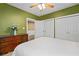 Neutral bedroom with multiple closets, a dresser, and ceiling fan at 893 Paces Farm Sw Trl, Marietta, GA 30064